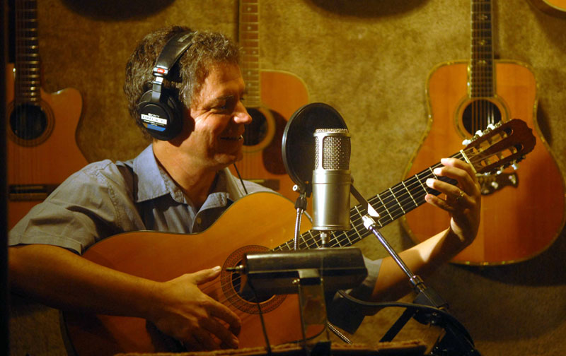 Bruce in booth with guitar